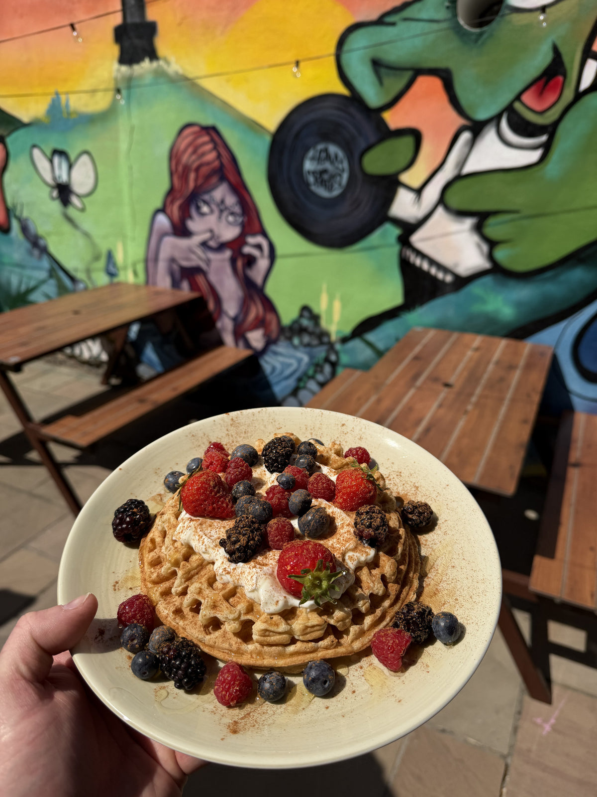 Waffles topped with berries on the BALANCE terrace