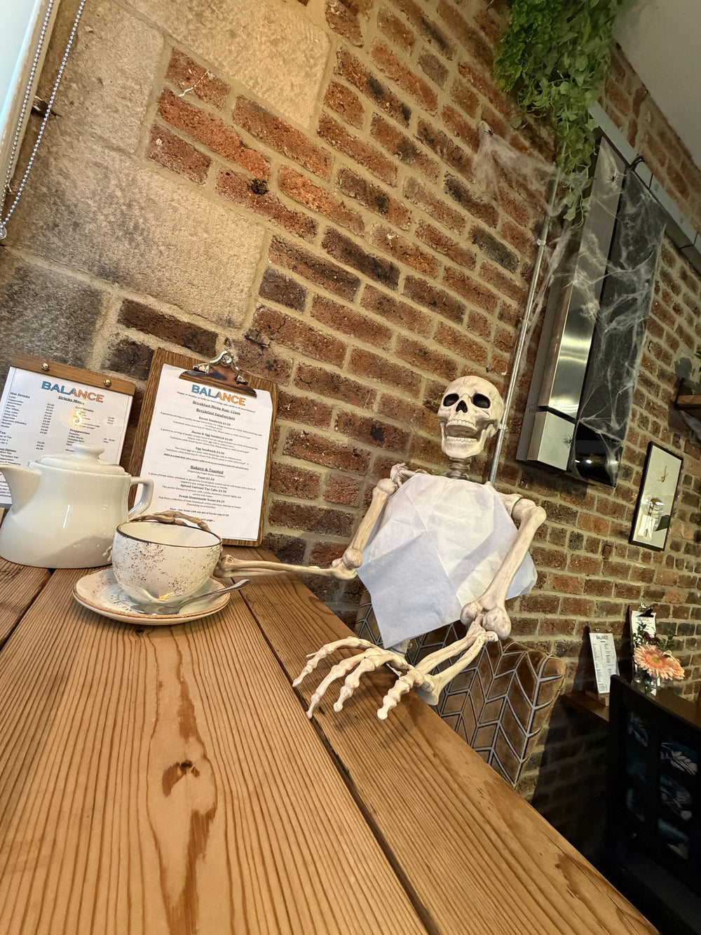 Coffee and a playful skeleton display inside BALANCE