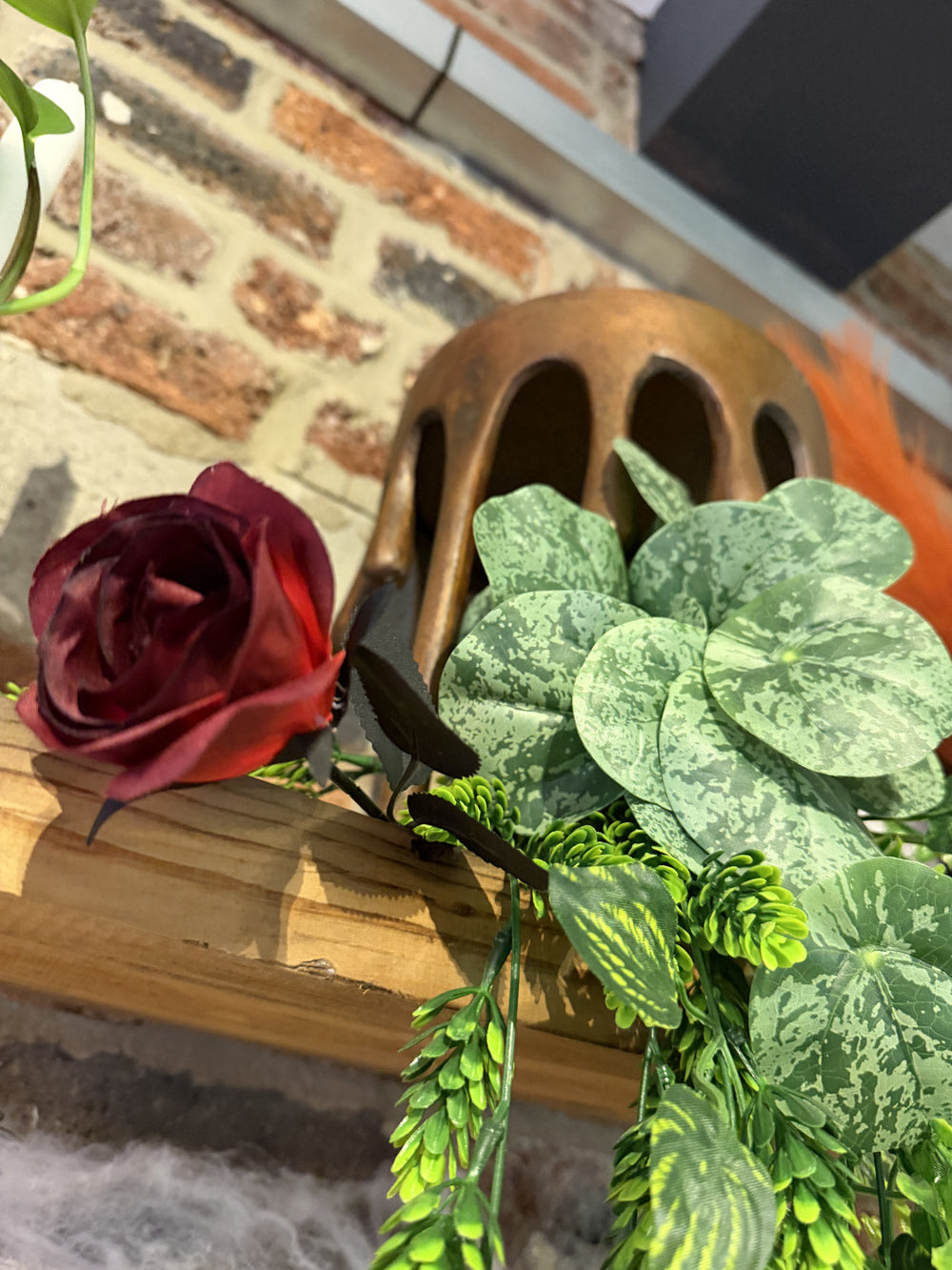 Flowers against the exposed brick wall at BALANCE