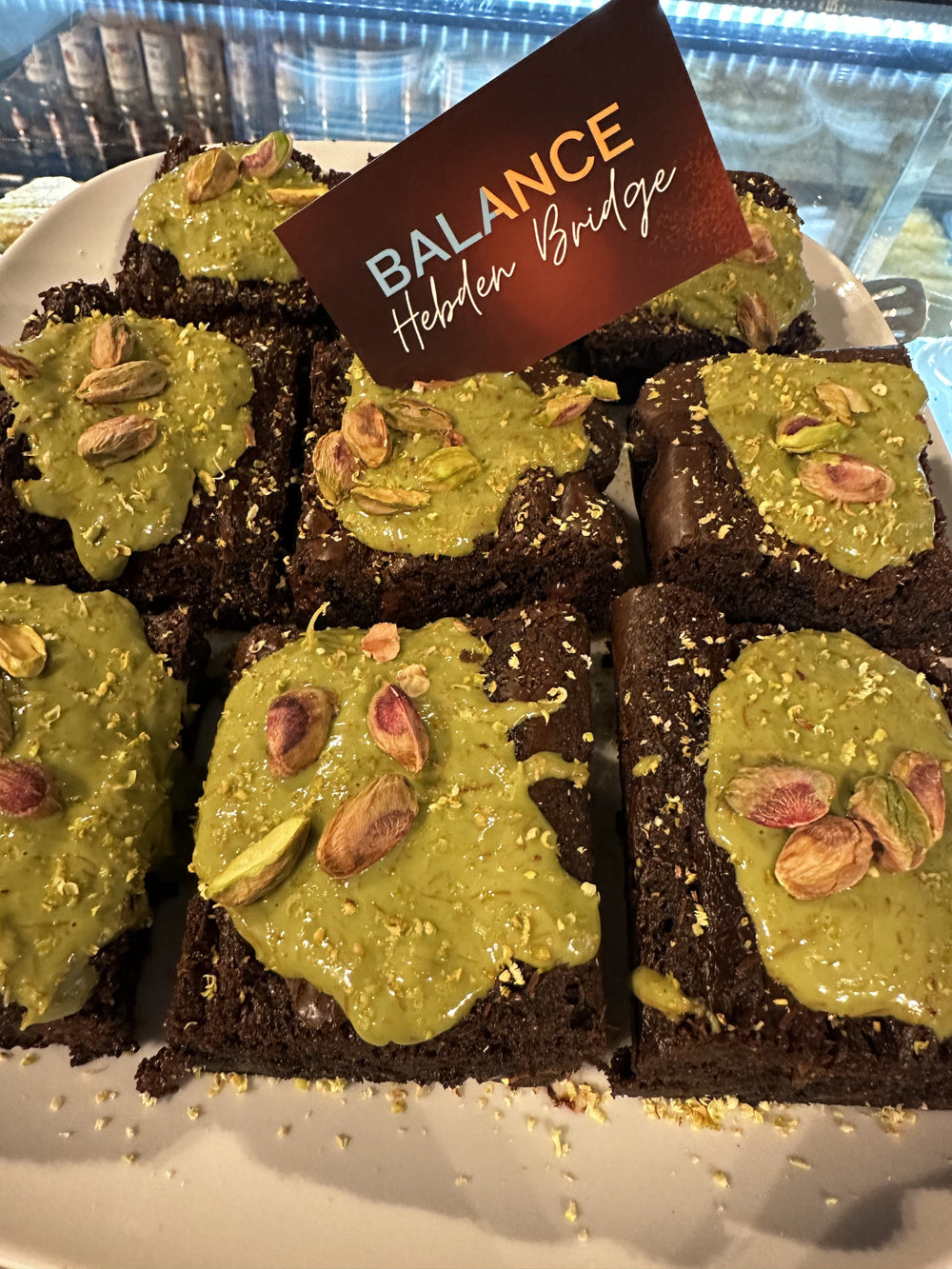 Chocolate brownies with green topping on the BALANCE counter