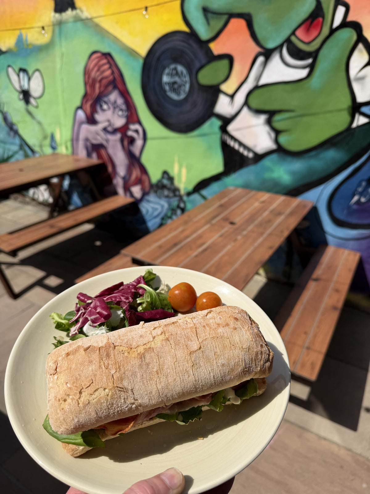 A filled baguette and salad on the BALANCE terrace