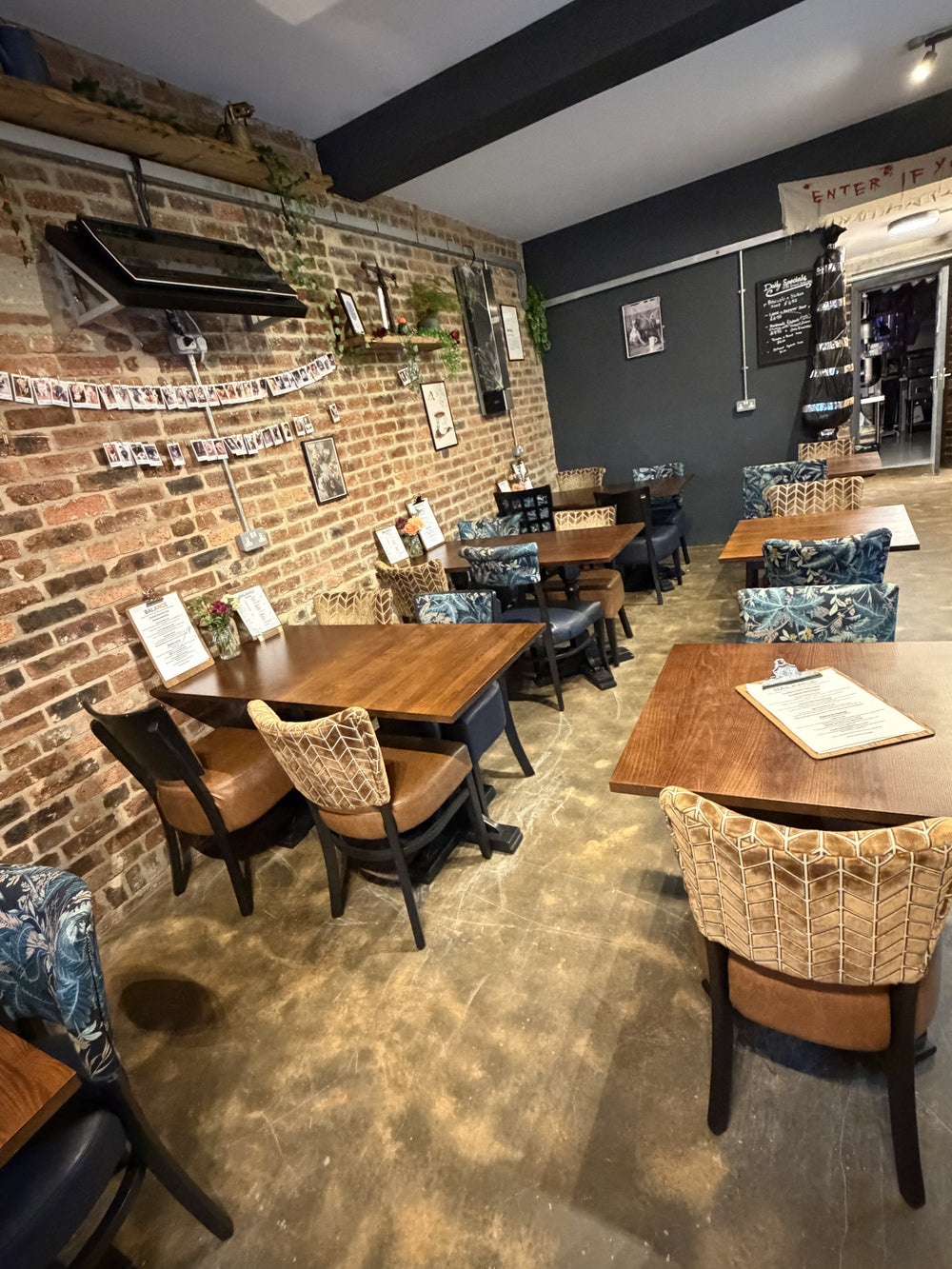 Tables and exposed brick inside BALANCE